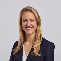 Headshot photo of Celia Waring- a woman with long blonde hair smiling