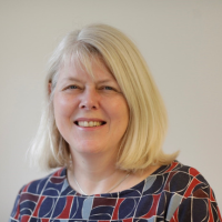 Headshot photo of Doctor Clare Mills- a woman with shoulder-length blonde hair smiling